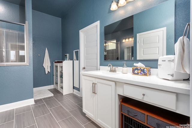 bathroom with vanity and walk in shower