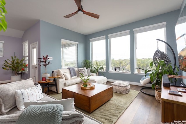 interior space with ceiling fan