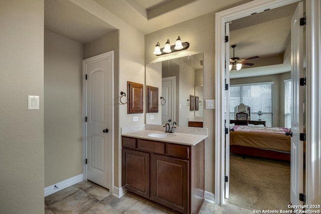 bathroom featuring ceiling fan and vanity