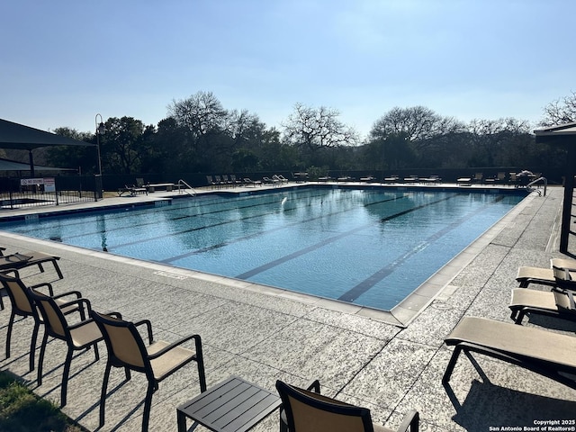 community pool with a patio