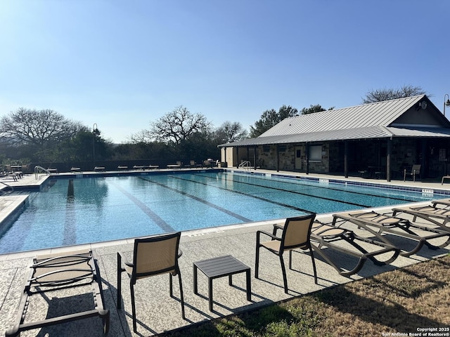 pool featuring a patio area