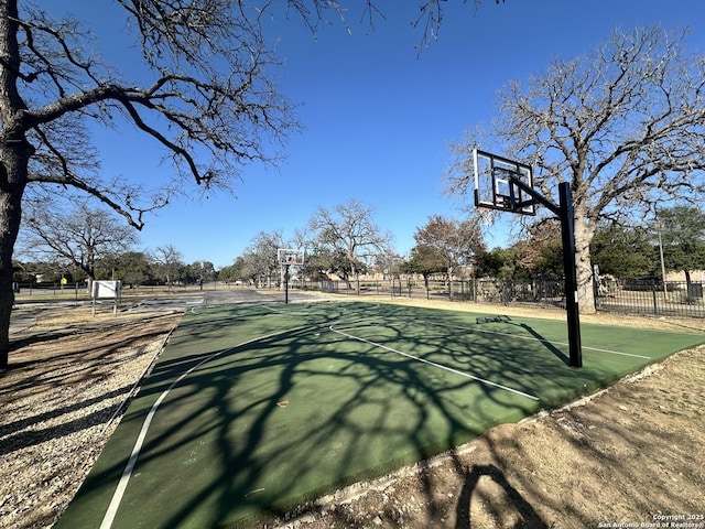 view of sport court featuring community basketball court and fence