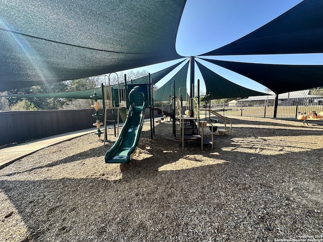 community jungle gym with fence