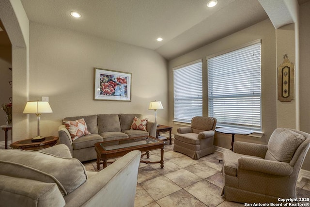 living room with arched walkways, lofted ceiling, baseboards, and recessed lighting