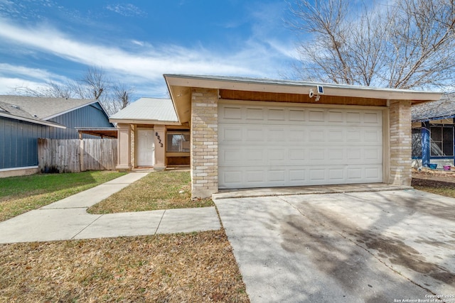 single story home featuring a garage