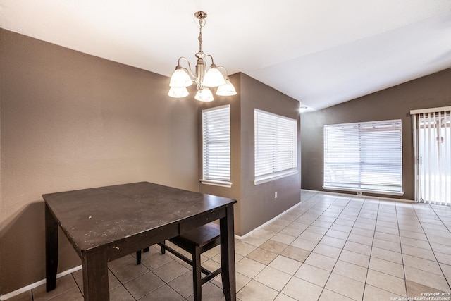 tiled dining room featuring vaulted ceiling and an inviting chandelier