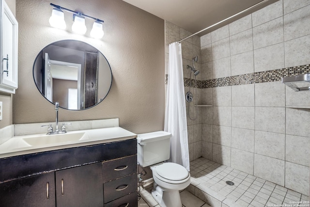 bathroom featuring vanity, toilet, and walk in shower