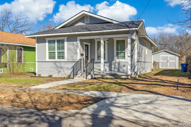 bungalow-style home featuring a storage shed and a porch