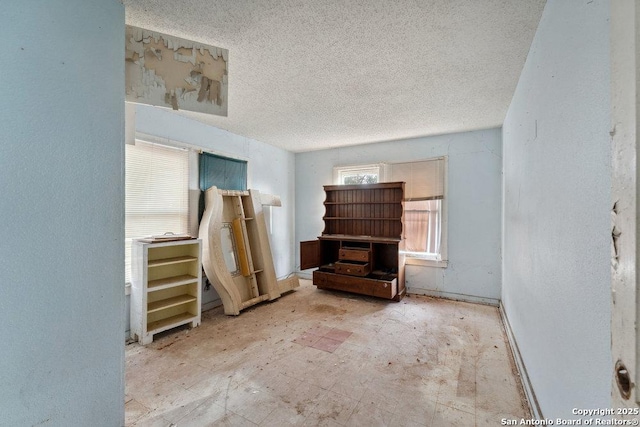 interior space with a textured ceiling