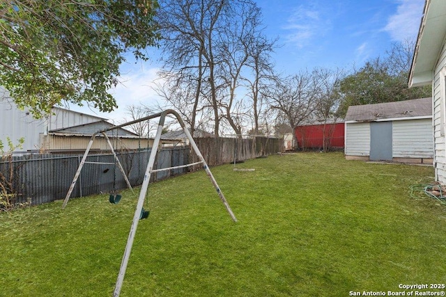 view of yard with a storage unit