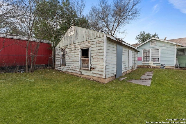 view of outdoor structure with a lawn