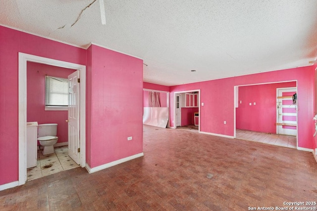 unfurnished living room featuring a textured ceiling