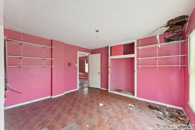 unfurnished bedroom featuring a textured ceiling