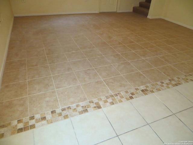 spare room with light tile patterned floors