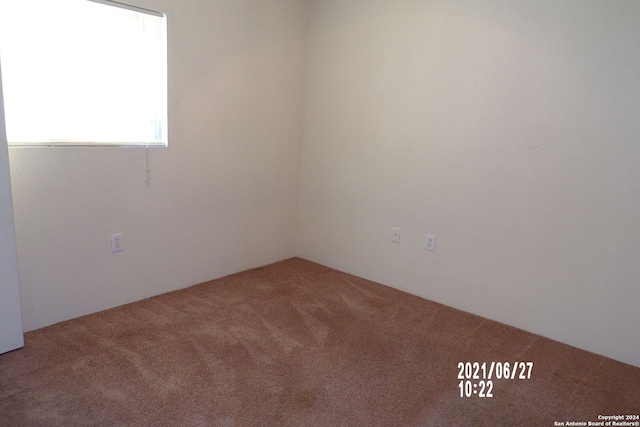 spare room with carpet flooring