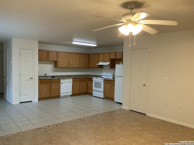 kitchen with sink, white appliances, light tile patterned floors, and ceiling fan