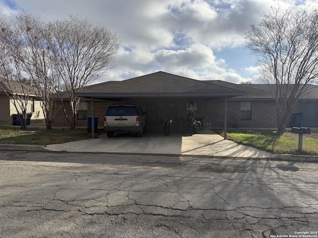 view of front of home with a carport