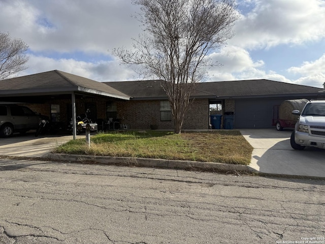 single story home with a garage and a front yard