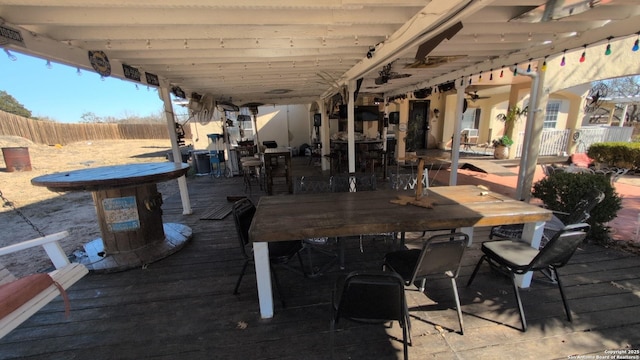 view of patio / terrace with a wooden deck and exterior bar