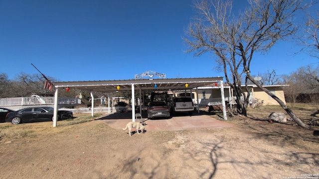 view of vehicle parking featuring a carport