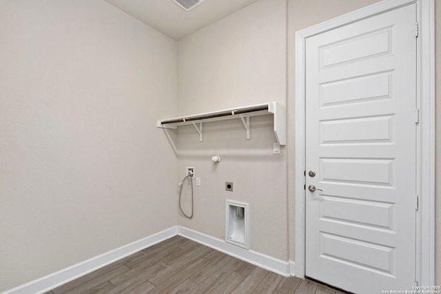 laundry area featuring hardwood / wood-style floors, gas dryer hookup, washer hookup, and hookup for an electric dryer