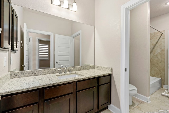 full bathroom with tiled shower / bath combo, vanity, tile patterned floors, and toilet