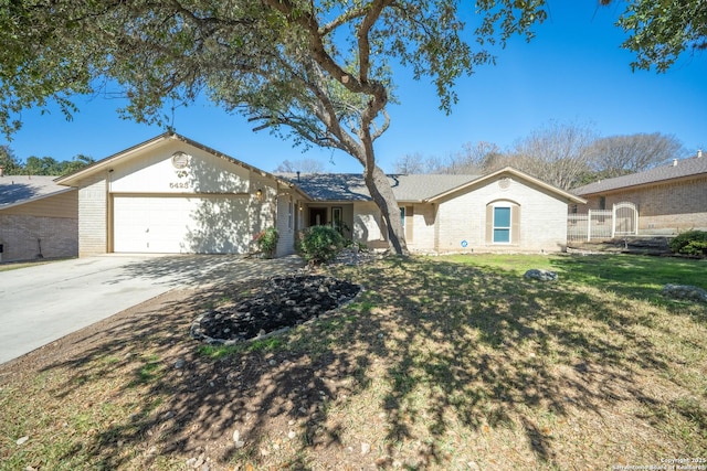 single story home featuring a garage and a front yard