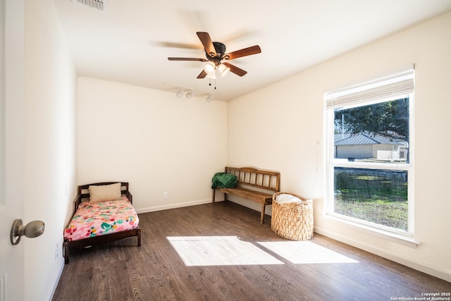 sitting room with hardwood / wood-style flooring and ceiling fan