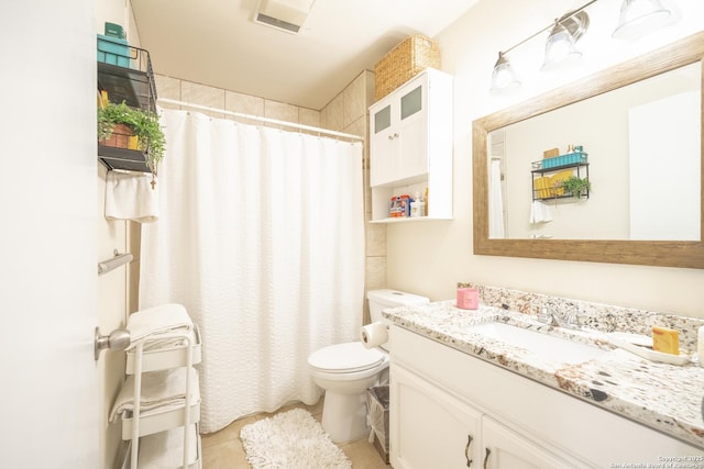 bathroom featuring vanity, curtained shower, and toilet