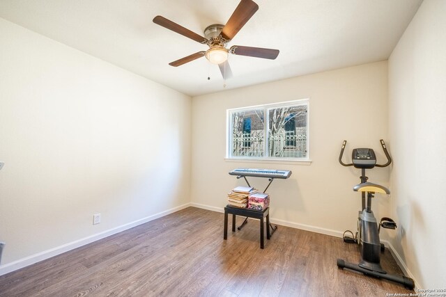 misc room with ceiling fan and wood-type flooring