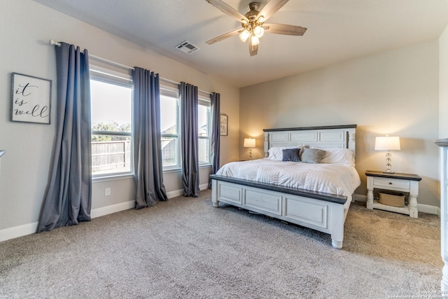 bedroom featuring ceiling fan and light colored carpet