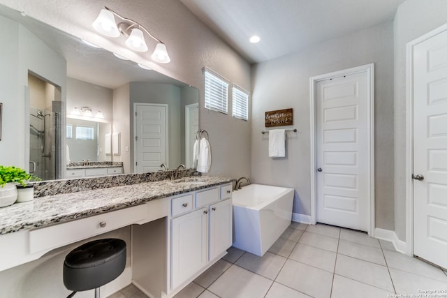 bathroom with tile patterned floors, vanity, and separate shower and tub