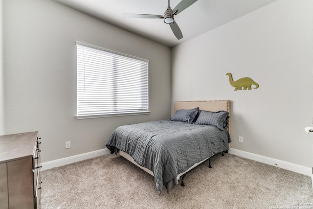 bedroom with ceiling fan and light carpet