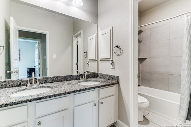 full bathroom featuring vanity, shower / tub combo, tile patterned flooring, and toilet