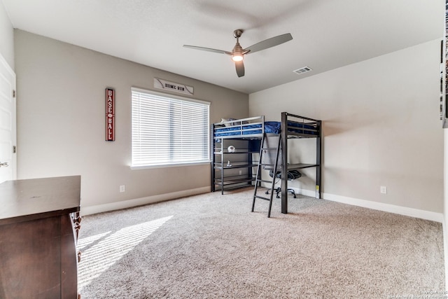 bedroom with ceiling fan and carpet