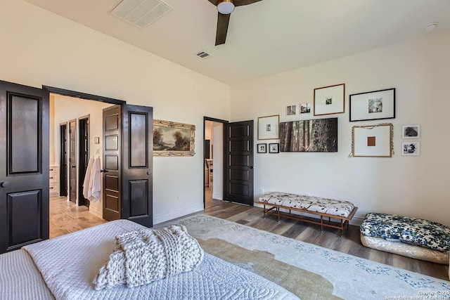 bedroom with wood-type flooring and ceiling fan