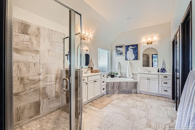 bathroom featuring lofted ceiling, vanity, and shower with separate bathtub