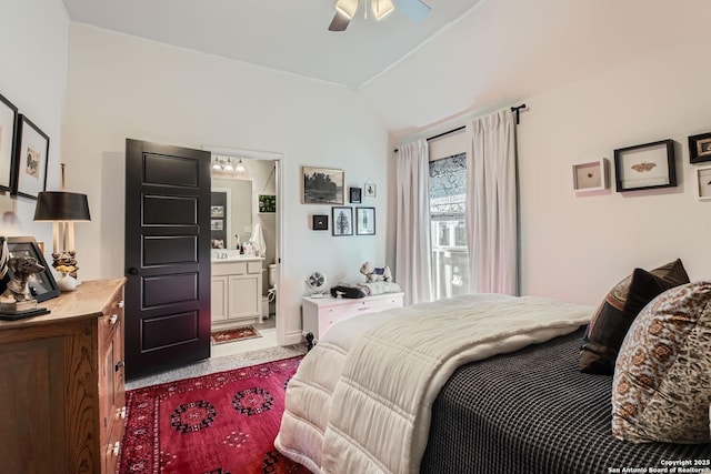 carpeted bedroom featuring ensuite bathroom and ceiling fan