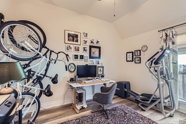 office featuring hardwood / wood-style flooring and vaulted ceiling