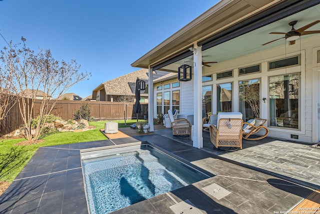 view of pool featuring a patio and ceiling fan