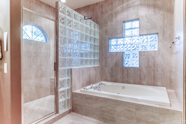 bathroom with tile patterned flooring and plus walk in shower