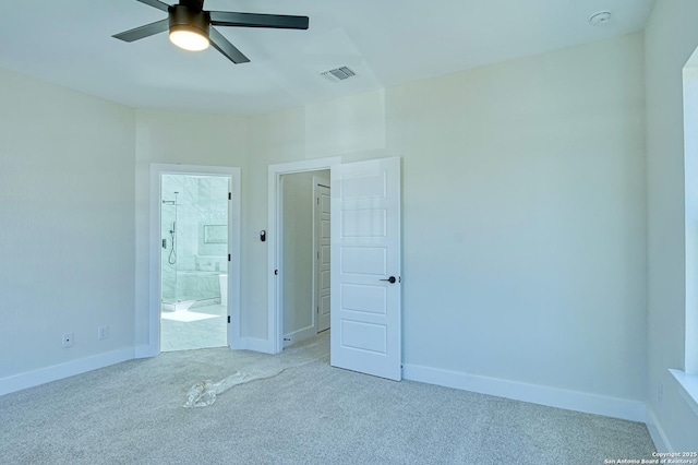 empty room featuring light carpet and ceiling fan