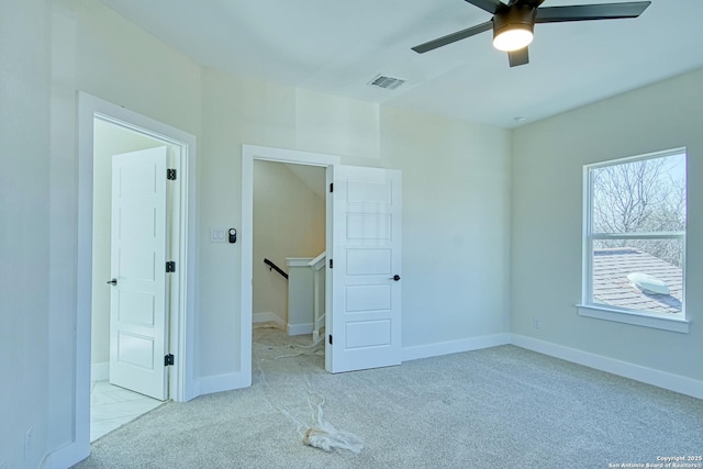 unfurnished bedroom with light carpet and ceiling fan