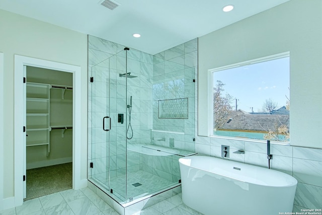 bathroom featuring plus walk in shower