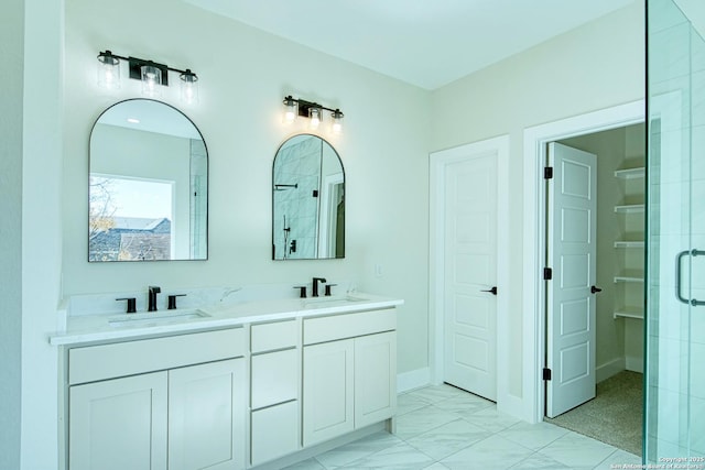 bathroom featuring vanity and an enclosed shower