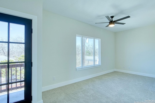 spare room with carpet flooring and ceiling fan