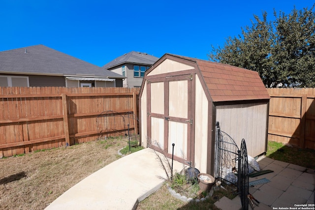 view of shed featuring a fenced backyard