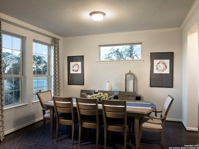 dining space with crown molding, dark hardwood / wood-style floors, and a textured ceiling