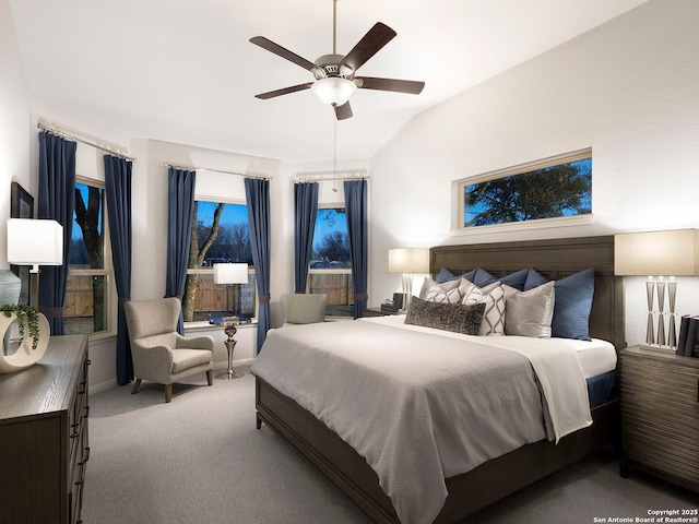 carpeted bedroom with lofted ceiling and ceiling fan