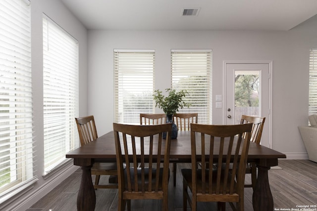 dining room featuring dark hardwood / wood-style flooring